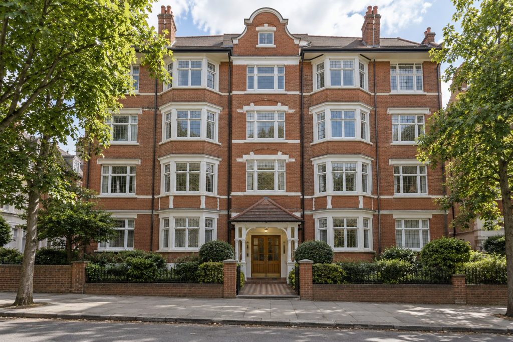 Front exterior, eye-level view of the building and its entrance - 1-bedroom flat in Clapham