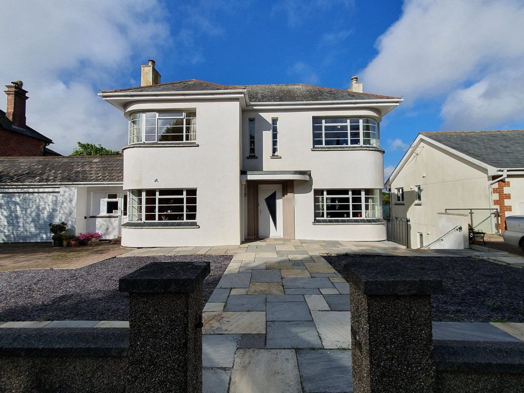 1930s Art Deco style white detached house with curved bay windows, Redruth, Cornwall