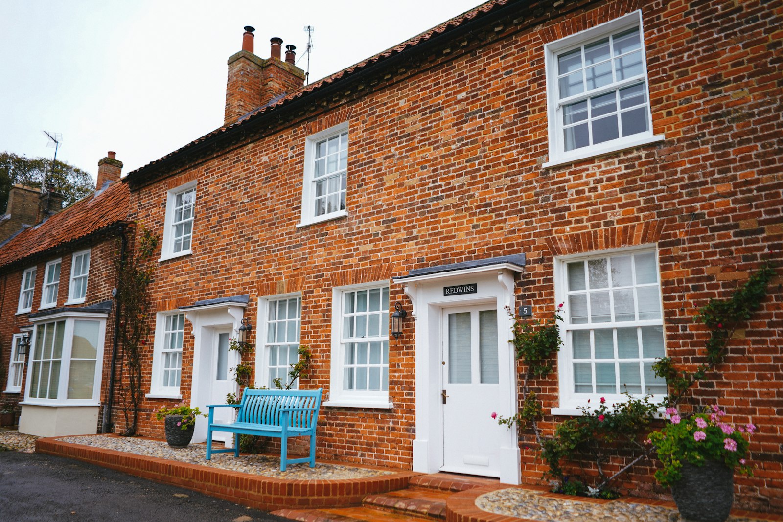 Red brick Victorian terrace with white sash windows