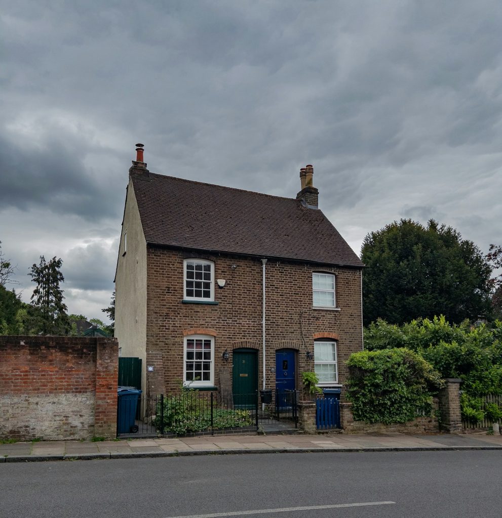 Victorian brick semi-detached house with two front doors