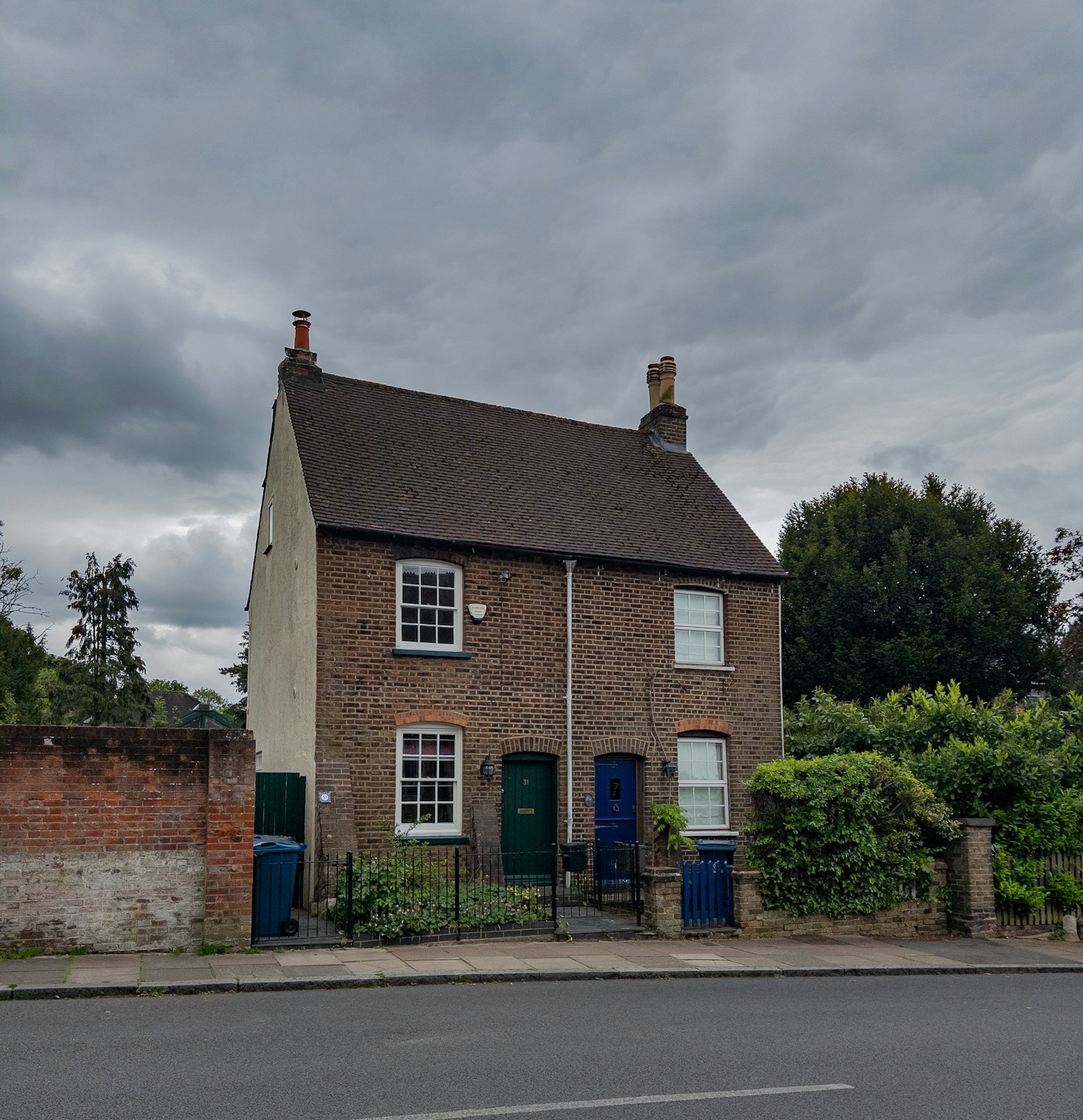 Victorian brick semi-detached house with two front doors