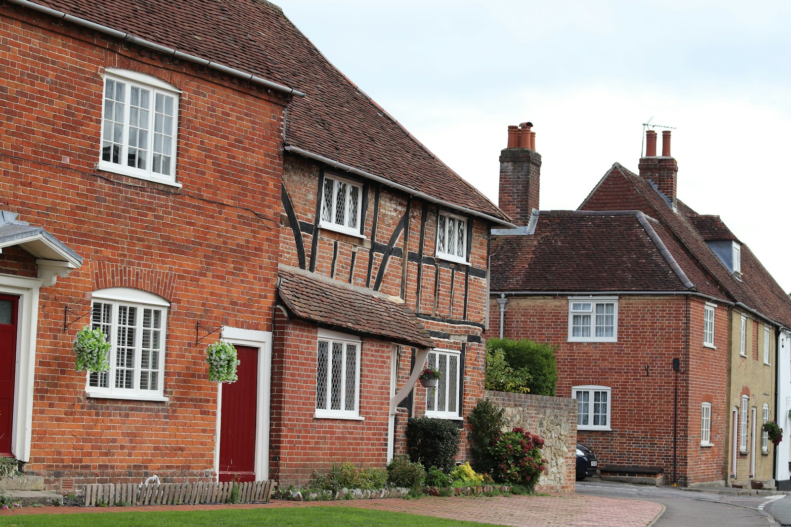 Brick and timber-framed cottages in a row