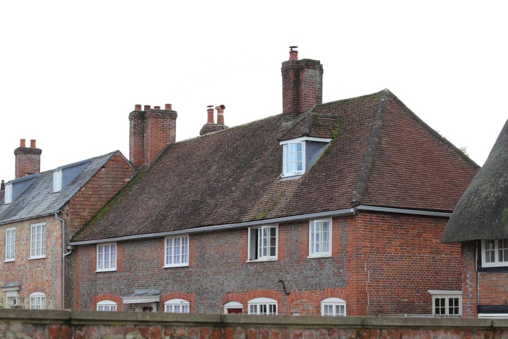 Brick and flint cottages with tiled roofs and dormers