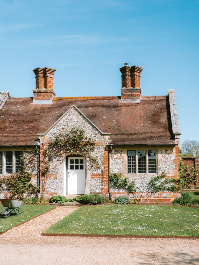 Flint and brick cottage with a red tiled roof