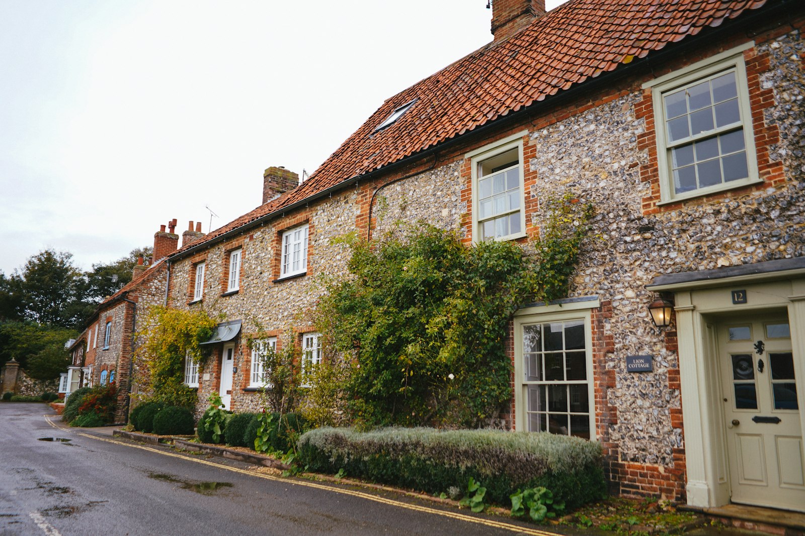Flint and brick cottages in a row