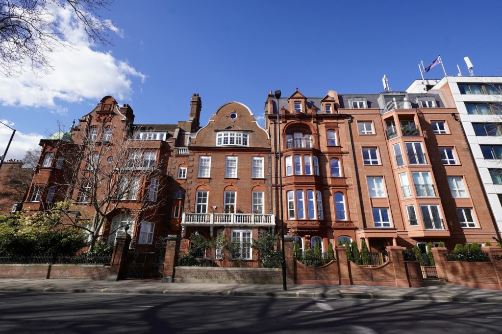Row of Victorian red brick apartment blocks