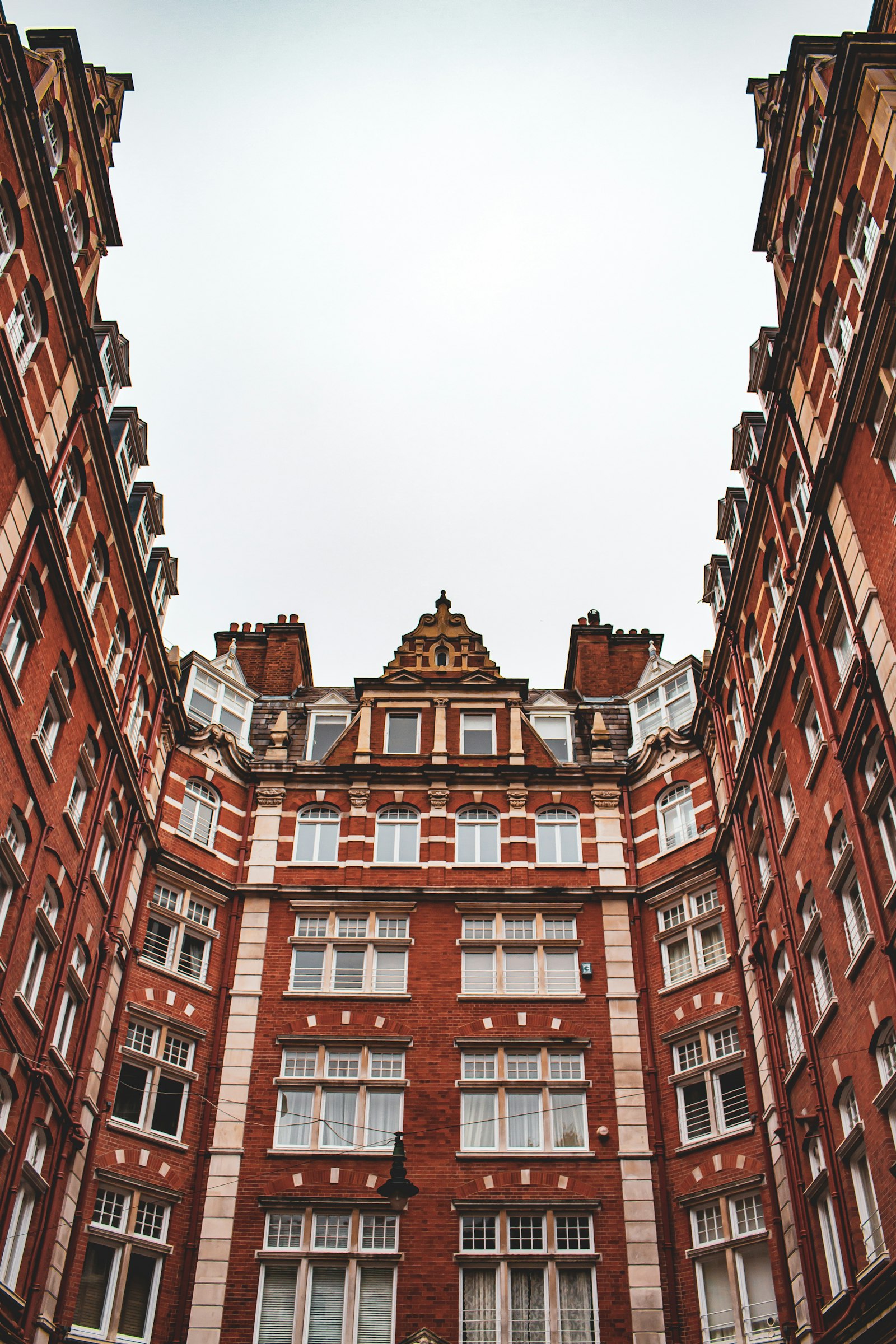 Red brick Edwardian mansion block with tall windows