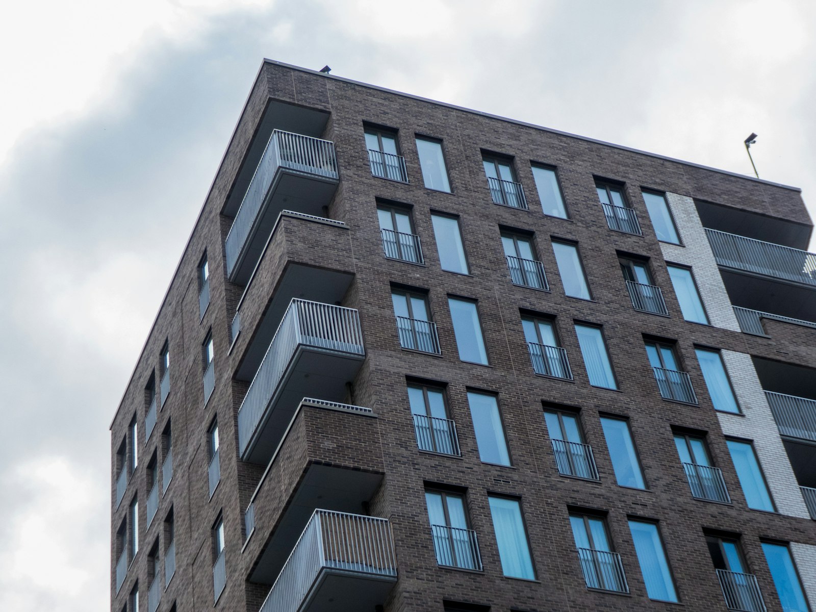 Modern brick apartment block with balconies