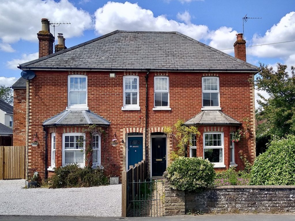 Red brick Victorian semi-detached pair with slate roof and bay windows, Ash, Surrey