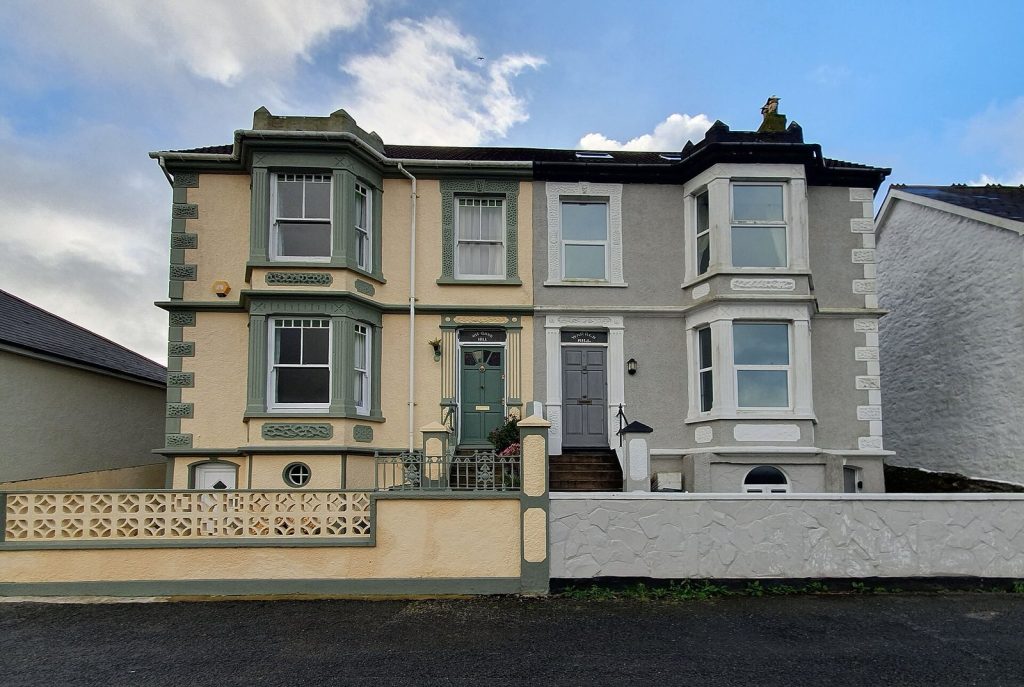 Victorian semi-detached pair with bay windows and painted render, Camborne, Cornwall