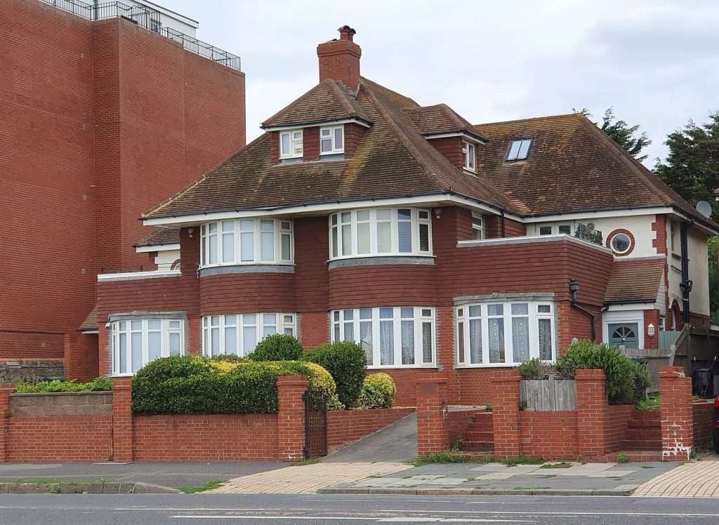 1930s red brick semi-detached pair with curved bay windows, Hove, East Sussex